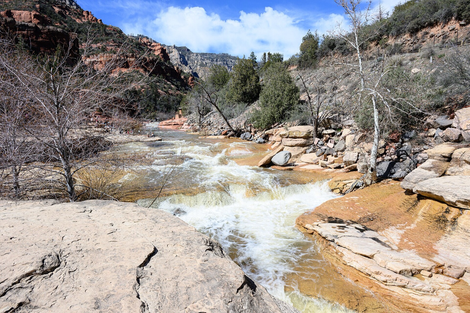 Oak Creek running over red sandstone ledges through Slide Rock State Park in Oak Creek Canyon, Arizona